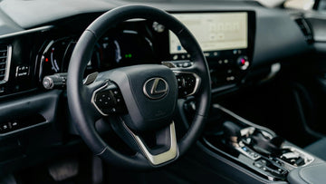 Lexus hybrid SUV interior showing digital dashboard and hybrid system display