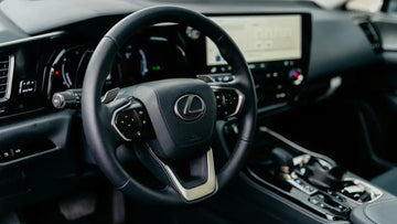 Lexus hybrid SUV interior showing digital dashboard and hybrid system display