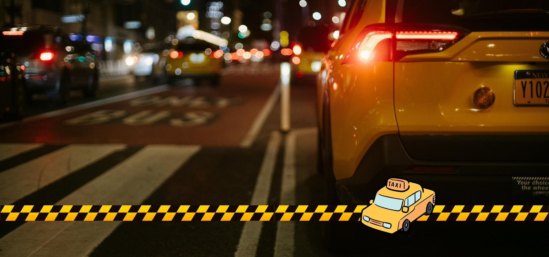 Yellow taxi on a city street at night with a cartoon taxi icon.